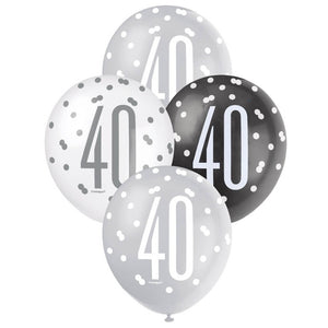 Four balloons with polka dot patterns and the number '40' on a white background