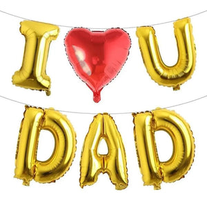 Gold letter balloons spelling 'I U × DAD' with a red heart balloon on a white background