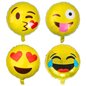 Four emoji-themed round foil balloons with different facial expressions on a white background