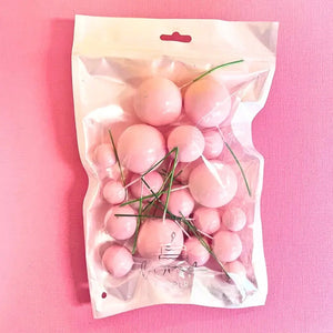 Pastel pink cake decoration foam balls on wire picks