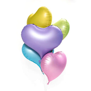 Colourful heart-shaped balloons on a white background