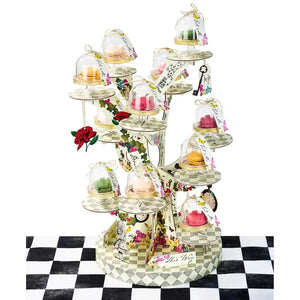Alice in Wonderland tree shaped cardboard cake stand with branches holding cupcakes, Mad Hatter tea party dessert display centrepiece