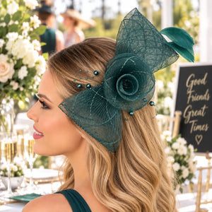 Bella green flower fascinator hair clip worn with loose waves