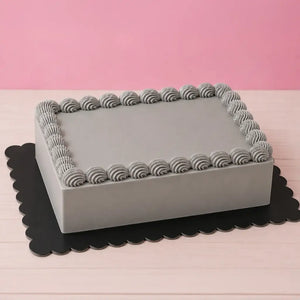 Black rectangular scalloped cake board for dramatic cake displays