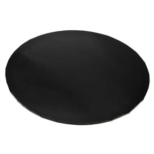 Close-up of the black masonite cake board showing its round shape and rigid edge