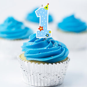 Boys blue and white number 1 birthday candle on cupcake