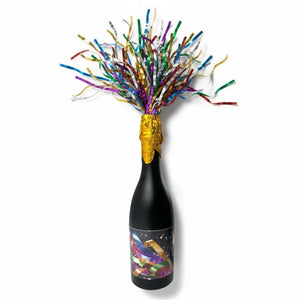 Long rainbow foil confetti bursting from champagne bottle popper