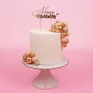 balloon style cake topper champagne gold balls on cake