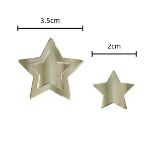 Mixture of solid and hollow ivory paper stars for party decorating