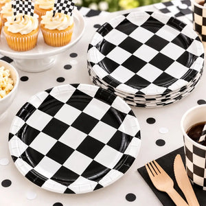 Black and white checkered paper plates arranged on a racing car birthday party table