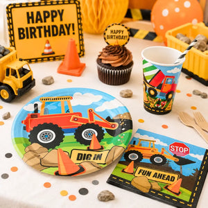Children's birthday party table with construction-themed plates, cups, and napkins.