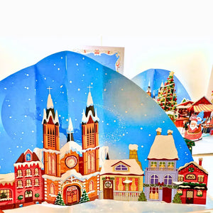 Whimsical 3D snowy village card with dogs enjoying holiday fun