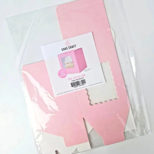 Flat-packed pink packaging box for one standard cupcake