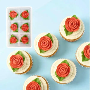 Tiny red edible rose cake decorations with leaves