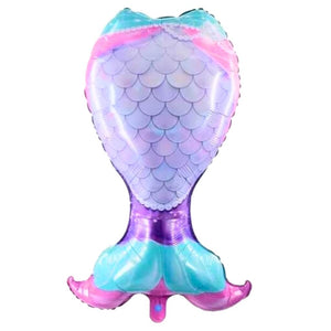 Mermaid tail-shaped balloon with blue pink purple scales on a white background