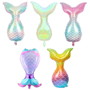 Five colourful mermaid tail-shaped balloons on a white background