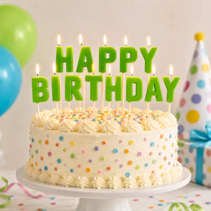 Glow in the dark happy birthday candles on cake