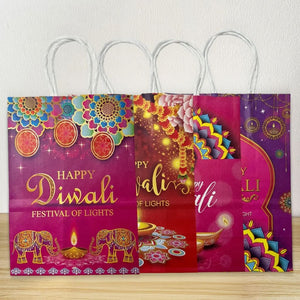 4 Diwali-themed paper bags with colorful designs and 'Happy Diwali Festival of Lights' text.