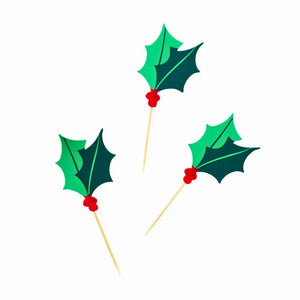 Holly and berry Christmas cupcake toppers adding seasonal cheer to holiday tables