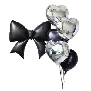 Matte black bow tie and silver heart balloon bundle party decorations