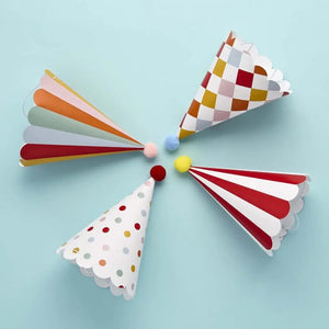 Funfair party hats with stripes and pom poms