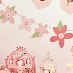 Pink floral garland with green leaves for princess birthday or baby showe