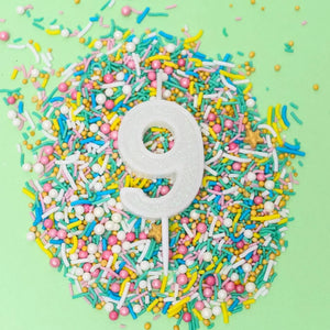Mini white glitter number 9 candle for birthday cake