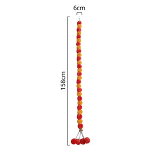 Orange Indian traditional pom pom garland with hanging bell decoration size