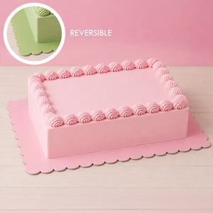 Reversible pink and green rectangle cake board with scalloped edges