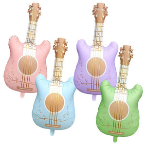 Four inflatable guitar-shaped balloons in pink, blue, purple, and green on a white background.