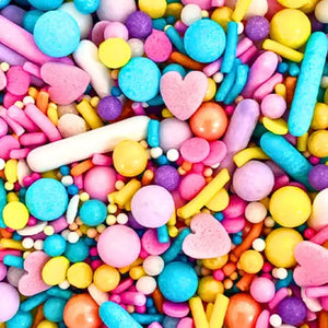 Close up of gluten-free rainbow pearls, hearts, and rods for baking