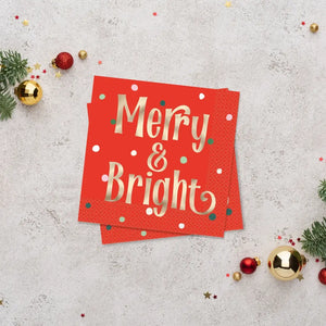 Red napkins with gold foil Merry & Bright lettering and dotted accents