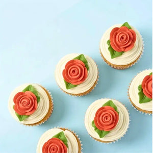 Small rose cake decorations with green leaves