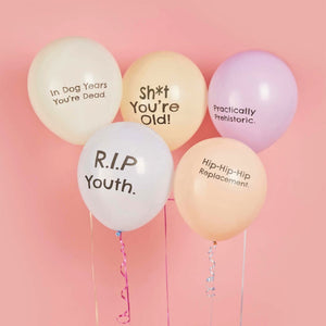 Pack of 5 cheeky 30cm latex birthday balloons with humorous slogans including Sh*t You’re Old.