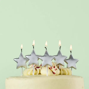 Metallic silver star candles for birthday cakes