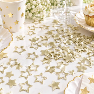 Ivory star-shaped paper confetti with solid and hollow star designs