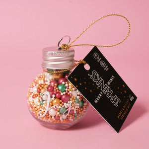 Red, green, gold and pearl Christmas sprinkles in assorted sizes