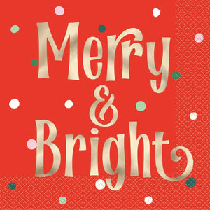 Christmas table napkins featuring gold foil Merry & Bright text on red background