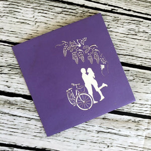 Couple With Bicycle Under Wisteria Arch 3D Pop Up Greeting Card - Online Party Supplies