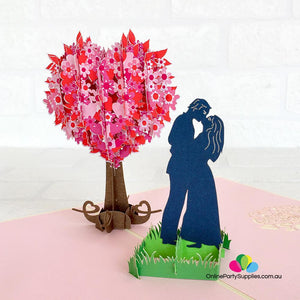 Handmade Silhouette Couple Kissing Near Pink Heart Tree 3D Pop Up Card - Online Party Supplies