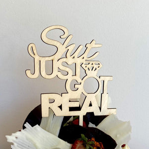 Wooden 'Shit Jut Got Real' Engagement Cake Topper