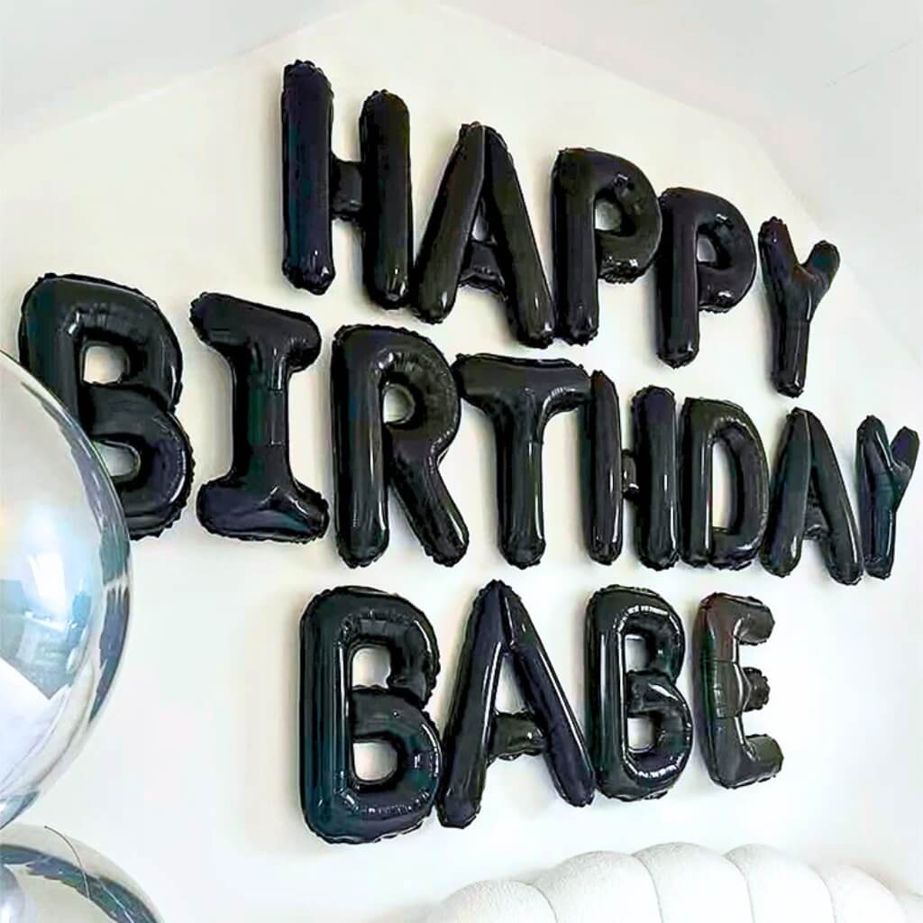 Black 'Happy Birthday Babe' balloons on a white background