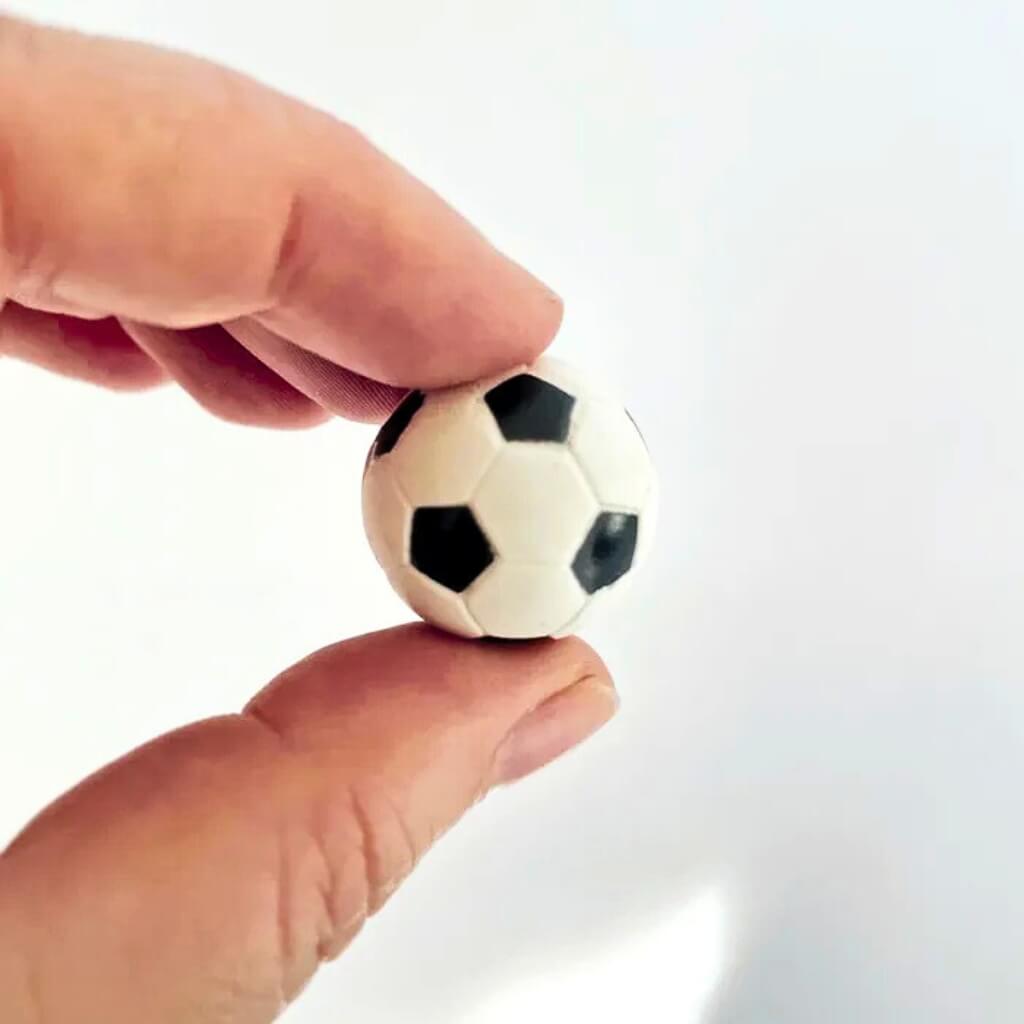 Black and white plastic football cake decoration