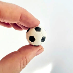 Black and white plastic football cake decoration