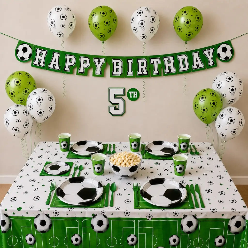 Children's birthday party setup with soccer-themed decorations and tableware.