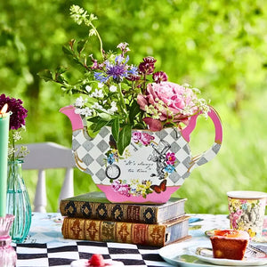 Pink Alice in Wonderland teapot vase holding fresh flowers on party table