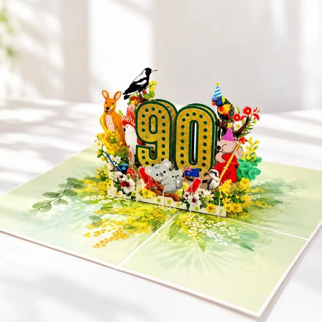 Glittering gold 90 birthday card surrounded by Australian wildlife
