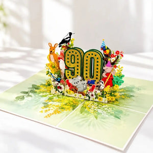 Glittering gold 90 birthday card surrounded by Australian wildlife