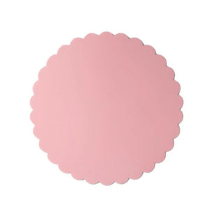 Pastel pink scalloped cake board for princess birthday cakes