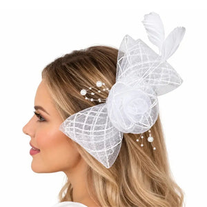 Bella bridal fascinator positioned beside an elegant wedding hairstyle
